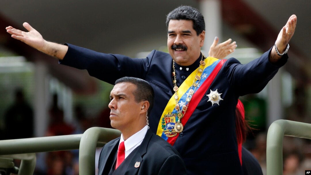 Venezuela's President Nicolas Maduro holds out his arms as arrives to attend a military parade commemorating the country's Independence Day in Caracas, Venezuela, July 5, 2017.