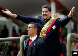 Venezuela's President Nicolas Maduro holds out his arms as arrives to attend a military parade commemorating the country's Independence Day in Caracas, Venezuela, July 5, 2017.