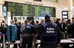 Police search passenger bags at the Central Station in Brussels, March 23, 2016.