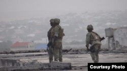 Gaashaan soldiers shortly after re-taking control of the Somali parliament building from al-Shabab fighters in on May 24, 2014. (Somalia Handout Photo)