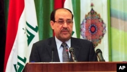 Iraqi Prime Minister Nouri al-Maliki speaks during Convergence of religions conference in Baghdad, Iraq, Saturday, April 27, 2013.