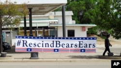 A sign hangs in Blanding, Utah as U.S. Interior Secretary Ryan Zinke arrived in the town, where he took a helicopter tour to see Bears Ears National Monument, May 8, 2017.