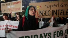 A climate activist chants slogans during a protest against worrying levels of air pollution in Romanian cities, in Bucharest, Romania, February 14, 2020. (Inquam Photos/Octav Ganea via REUTERS)