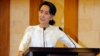 Myanmar State Counsellor Aung San Suu Kyi speaks at a memorial ceremony to mark one month from the killing of Ko Ni, prominent legal adviser to the government, and taxi driver Ne Win, Feb.26, 2017, in Yangon, Myanmar. 