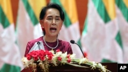 FILE - Myanmar's de facto leader Aung San Suu Kyi delivers a televised speech to the nation at the Myanmar International Convention Center in Naypyitaw, Myanmar, Sept. 19, 2017. A Nobel Peace laureate, she has been criticized for not doing enough to resolve the Rohingya crisis.