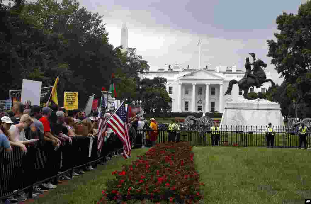 Demonstrators rally near the White House on the one year anniversary of the Charlottesville "Unite the Right" rally, Sunday, Aug. 12, 2018, in Washington. 