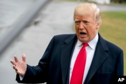 FILE - President Donald Trump speaks to reporters before boarding Marine One on the South Lawn of the White House in Washington, Feb. 23, 2018, to travel to Oxon Hill, Md. to speak at the Conservative Political Action Conference (CPAC).