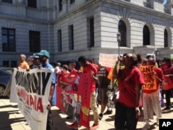 FILE - In Harrisburg, Pennsylvania, about 200 people attend the Higher Ground Moral Day of Action march, Sept. 12, 2016. A prominent part of their message was support for raising the minimum wage to $15 an hour.