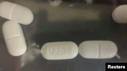 FILE - A seized counterfeit hydrocodone tablets in the investigation of a rash of fentanyl overdoses in northern California is shown in this Drug Enforcement Administration (DEA) photo released on April 4, 2016. 