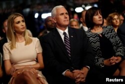 From left, Ivanka Trump, daughter of Republican nominee Donald Trump, sits with Republican vice presidential nominee Mike Pence and his wife, Karen Pence, at Hofstra University in Hempstead, New York, Sept. 26, 2016.