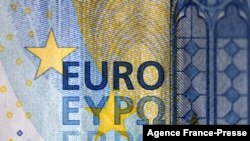 FILE - This file photograph taken in Dortmund on Jan. 27, 2020, shows the logo of a 20 Euro banknote. Jan. 1, 2022 marks the 20th anniversary of the euro entering circulation. 