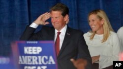 Republican candidate for Georgia Governor Brian Kemp and his wife Marty are seen during a campaign rally, Nov. 4, 2018, in Macon. 