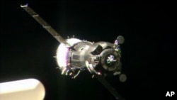 In this image taken from video provided by NASA, the Soyuz TMA-09M carrying three new Expedition 36 crew members approaches the International Space Station, May 29, 2013.
