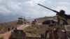 FILE - Troops from NATO and Afghan commando forces are pictured in a checkpoint during a patrol against Islamic State militants at the Deh Bala district in the eastern province of Nangarhar, July 7, 2018.