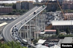 The collapsed Morandi Bridge is seen in the Italian port city of Genoa, Italy, August 16, 2018.