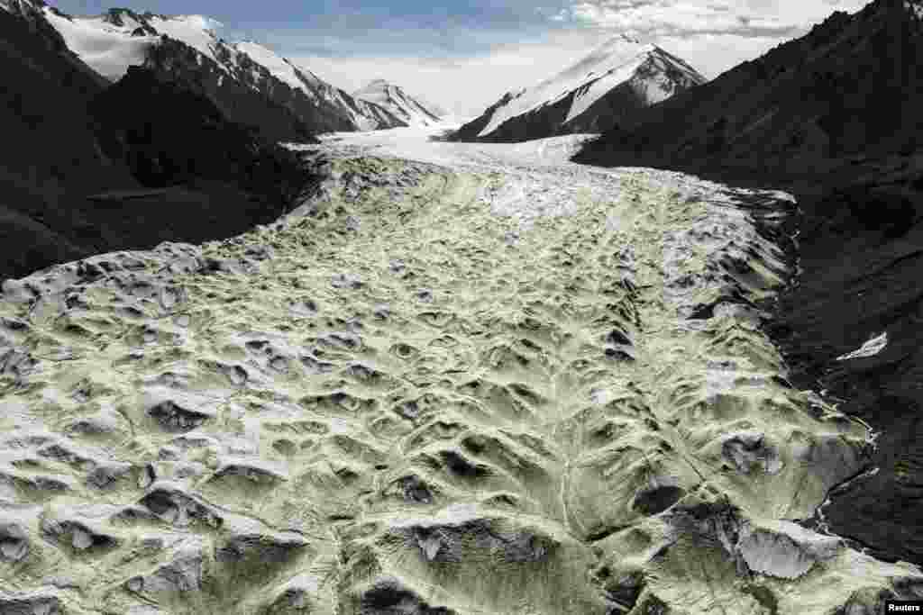 Meltwater flows over the Laohugou No. 12 glacier in the Qilian mountains, Subei Mongol Autonomous County in Gansu province, China.