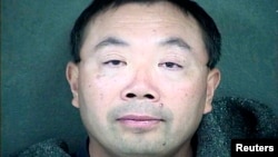 FILE - Zhang Weiqiang is shown in this Wyandotte County, Kansas, Detention Center handout photo released to Reuters Dec. 12, 2013. Zhang is one of two agricultural scientists from China who were charged with trying to steal samples of a variety of seeds from a biopharmaceutical company's research facility in Kansas, said Barry Grissom, spokesman for the U.S. attorney for the District of Kansas.