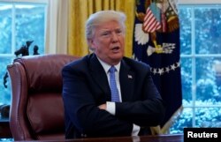 President Donald Trump speaks during an interview with Reuters at the White House in Washington, U.S., January 17, 2018.