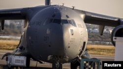 FILE - A Royal Air Force (RAF) C17 plane is seen on the tarmac ready to transport British tourists, who were wounded during the Imperial Marhaba hotel attack by a gunman, in Monastir airport, Tunisia, June 29, 2015. 
