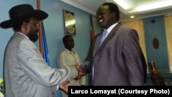 South Sudanese President Salva Kiir congratulates Joseph Montuel after naming him governor of Unity state.