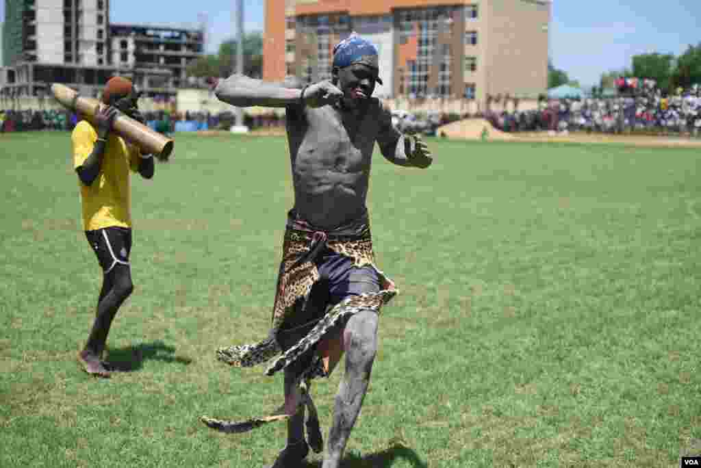 A Mundari wrestler dances between bouts during the "Wrestling for Peace" tournament at Juba Stadium in South Sudan's capital, April 16, 2016. (J. Patinkin/VOA)