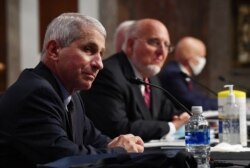 Dr. Anthony Fauci, director of the National Institute for Allergy and Infectious Diseases, CDC Director Dr. Robert Redfield