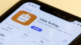The 'Click to Pray' app is a smartphone app designed to allow the faithful to pray with a click. Here it is seen on a mobile phone. (REUTERS/Guglielmo Mangiapane/Illustration)