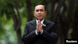 Thailand's Prime Minister Prayuth Chan-ocha gestures while speaking to media members at the Government House in Bangkok, Thailand June 6, 2019.