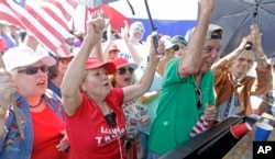 Cuban-American supporters celebrate in the Little Havana area in Miami, as they watch a televised broadcast as President-elect Donald Trump is sworn in as the 45th president of the United States, Friday, Jan. 20, 2017.