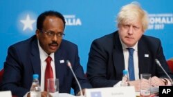 Britain's Foreign Secretary Boris Johnson listens during a National Security session as President of Somalia Mohamed Abdullahi Mohamed, left, speaks at the 2017 Somalia Conference in London, May 11, 2017. 