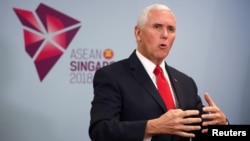 U.S. Vice President Mike Pence speaks during a news conference at the ASEAN Summit in Singapore, Nov. 15, 2018.