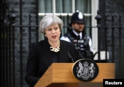 FILE - Britain's Prime Minister Theresa May speaks outside 10 Downing Street after an attack on London Bridge and Borough Market in London, June 4, 2017.