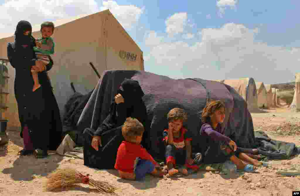 Displaced Syrians are seen at a camp in Kafr Lusin near the Bab al-Hawa border crossing with Turkey in the northern part of Syria's rebel-held Idlib province.