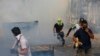 Tropas dispararam gás lacrimogéneo contra manifestantes, Venezuela,23 de Fevereiro. 