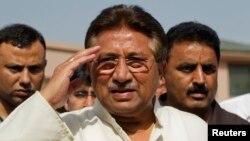 Pakistan's former president and head of the All Pakistan Muslim League (APML) political party Pervez Musharraf salutes as he arrives to unveil his party manifesto for the forthcoming general election at his residence in Islamabad, April 15, 2013. 