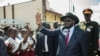 South Sudan President Salva Kiir greets schoolchildren at Juba International Airport on Sept. 13, 2018, after returning from the Ethiopian capital, Addis Ababa. There, the latest peace agreement with opposition leader Riek Machar was finalized.