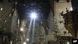In this photo taken Monday, Nov. 14, 2011, pilgrims and tourists visit the Church of the Nativity, believed by many to be the birthplace of Jesus Christ, in the West Bank city of Bethlehem.