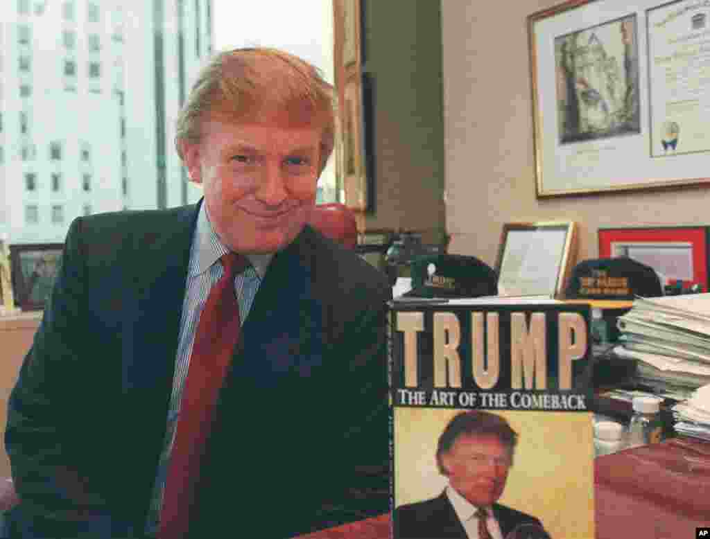 Donald Trump, the New York developer, poses in his Manhattan office beside a copy of his new book, "Trump: The Art of the Comeback." Trump has been promoting the book, in which he tells how he returned from near bankruptcy to a personal net worth estimate