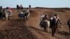 Сирийцы пробираются в иракский Курдистан за продовольствием и топливом
