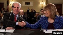 FILE - Reps. Bradley Byrne, R-Ala., and Jackie Speier, D-Calif., shake hands before a House Administration Committee hearing on preventing sexual harassment in the congressional workplace on Capitol Hill in Washington, Nov. 14, 2017. The House passed legislation on the matter in February 2018, and now that bill will have to be reconciled with Senate legislation.