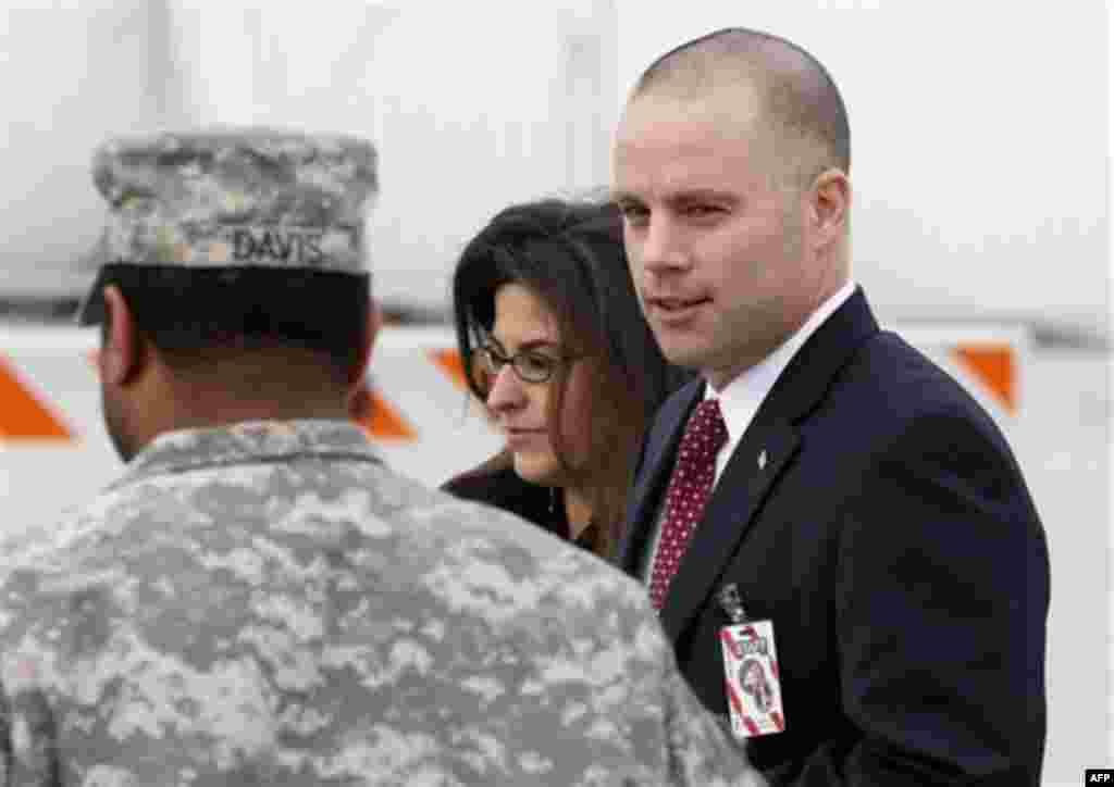 David E. Coombs, attorney for Army Pfc. Bradley Manning, right, leaves a courthouse in Fort Meade, Md., Friday, Dec. 16, 2011, during a recess in a military hearing that will determine if Manning should face court-martial for his alleged role in the WikiL