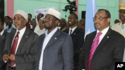 Somali president Sharif Sheik Ahmed, center, Prime Minister, Abdiwali Mohamed Ali, right, and parliament speaker Sharif Hassan Sheik Adan, left, during constituent assembly opening in Mogadishu, July 25, 2012. 