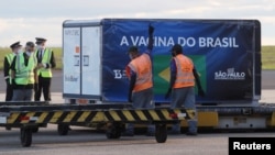 A refrigerated container with 'CoronaVac' COVID-19 vaccines, developed by Sinovac Biotech, arrives at Viracopos International Airport, in Campinas, Brazil December 24, 2020. (REUTERS/Amanda Perobelli)