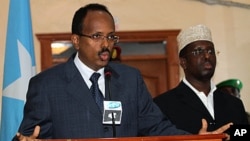 Somalia's Prime Minister Mohamed Abdullahi Mohamed speaking in the capital, Mogadishu, Sunday, June 19, 2011