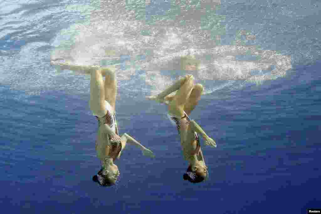 Anna-Maria Alexandri (AUT) and Eirini-Marina Alexandri (AUT) of Austria compete perform in the synchronized swimming duet free routine in Rio de Janeiro.