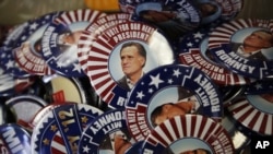Republican presidential candidate and former Massachusetts Gov. Mitt Romney campaign buttons are displayed ahead of the Republican National Convention in Tampa, Fla., on Aug. 26, 2012.