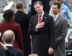 Eric Trump, center, and Donald Trump, Jr., attend the presidential inauguration of their father Donald Trump on Capitol Hill in Washington, Jan. 20, 2017.
