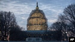 The Capitol Dome in Washington is illuminated early on Jan. 12, 2016, the day of President Barack Obama's final State of the Union address before Congress in Washington.