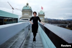 Swiss President and Minister of Environment, Transport, Energy and Communications, Doris Leuthard, 54, poses for a photograph on top of a roof next the Swiss Parliament in Bern, Switzerland, Feb. 24, 2017.