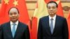 Chinese Premier Li Keqiang (R) and Vietnamese Prime Minister Nguyen Xuan Phuc attend a signing ceremony at the Great Hall of the People in Beijing, China, Sept. 12, 2016.